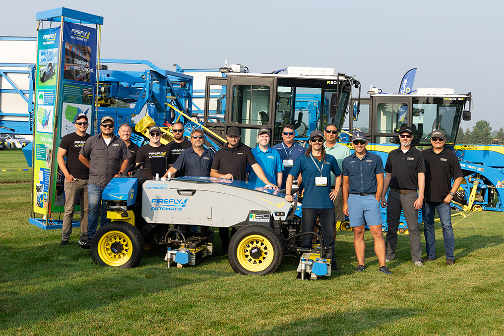 FireFly team members around machines