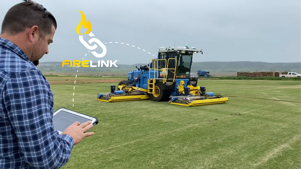 FireLink graphic showing man getting data on tablet from FireFly autonomous lawn mower