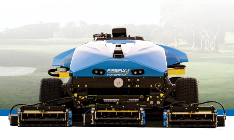 AMP mower in front of golf course