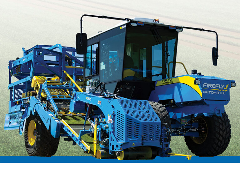 FireFly harvester in front of turf farm