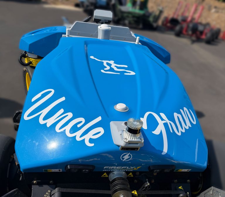 FireFly Robotics fairway mower with decals showing club logo and mower name